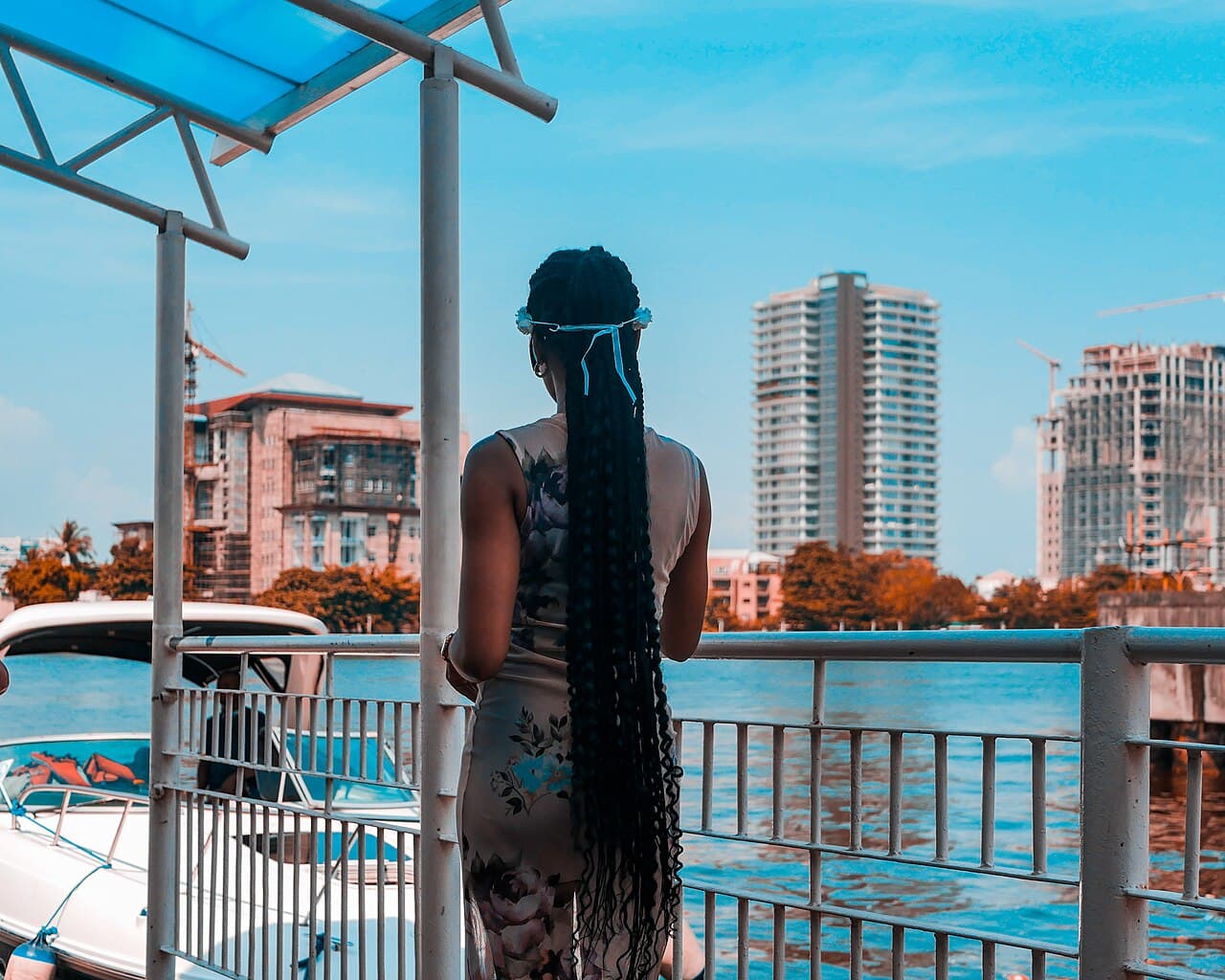 A woman on the Lagos jetty, by the lagoon