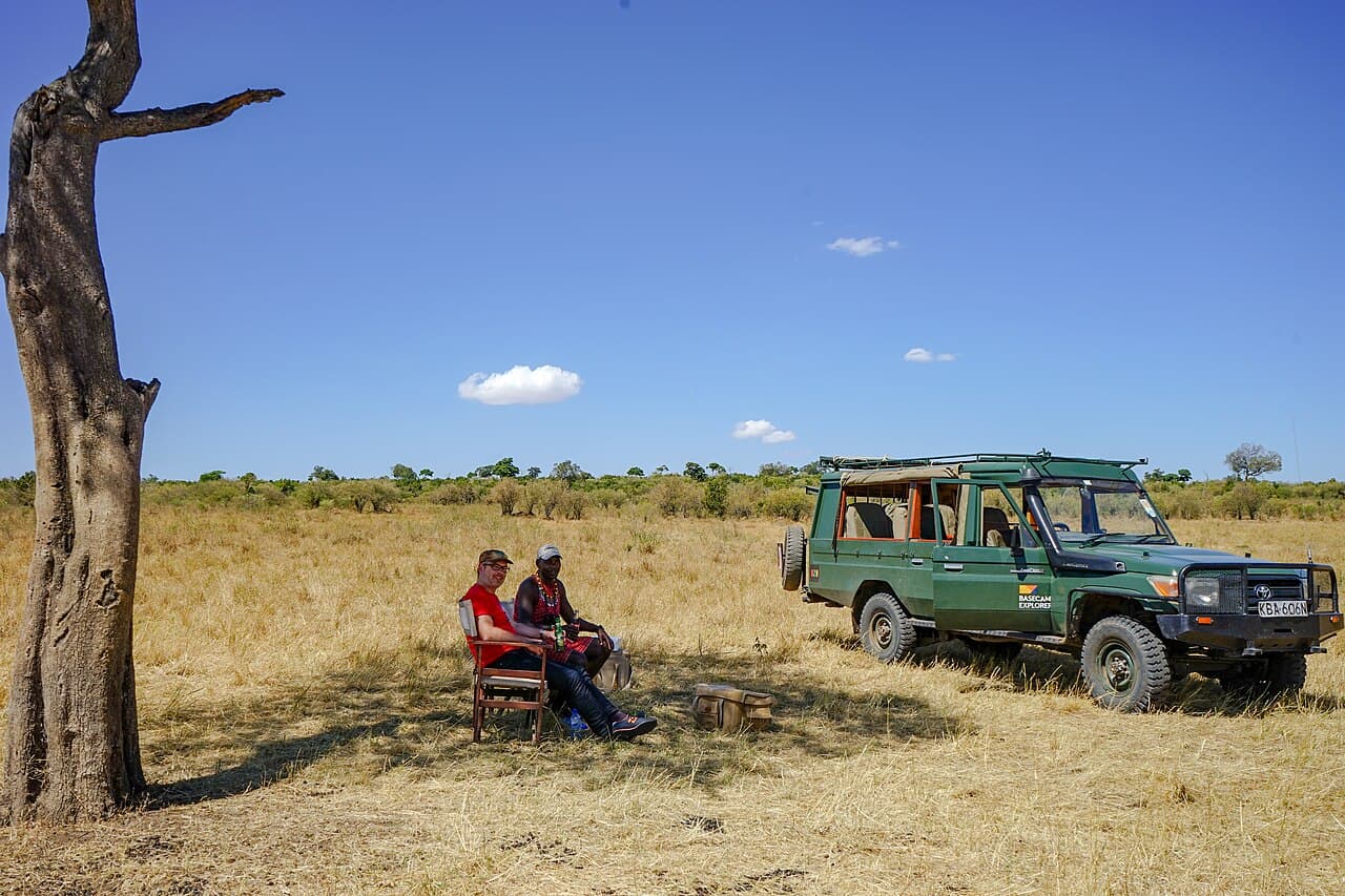 A safari vehicle on the Maasai Mara grassland